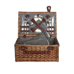 Panier de pique-nique en osier ouvert avec accessoires