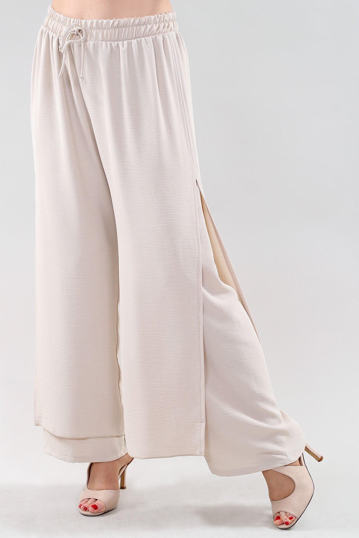 Pantalon ample beige rosé à taille élastique