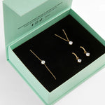 Coffret vert de bijoux dorés à pendentifs arrondis