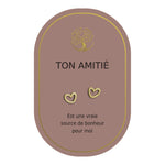 Boucles d’oreilles en cœurs dorés sur carte rose Earth Angel « Ton amitié ».