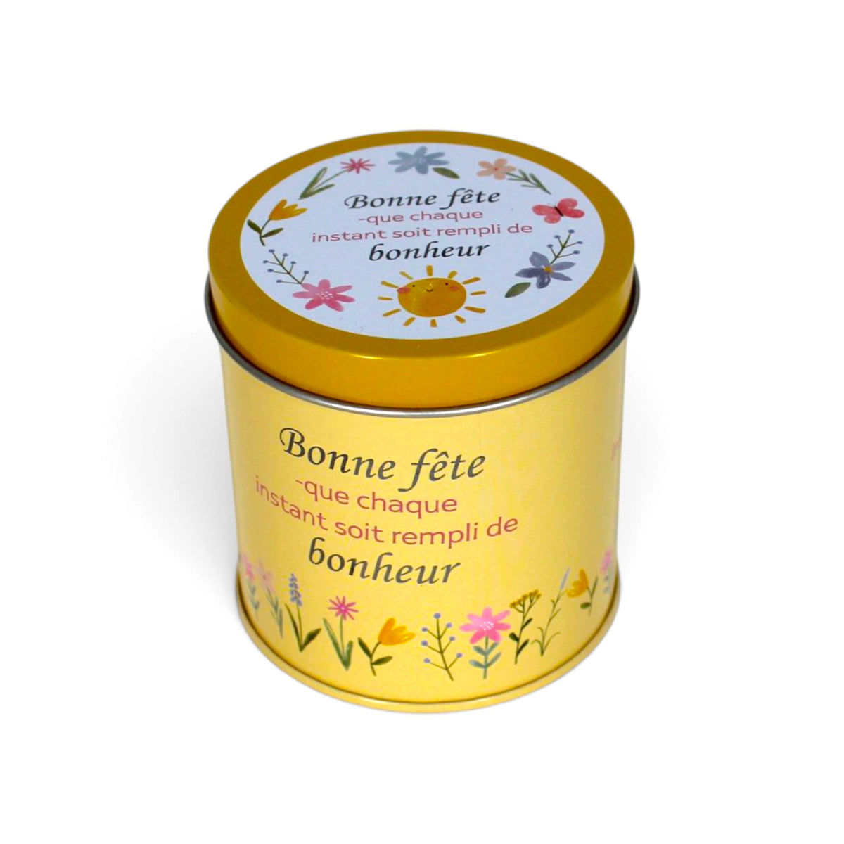 Bougie InnerVoice « Bonne fête – que chaque instant soit rempli de bonheur » en boîte métallique jaune, avec couvercle fermé et décor floral.