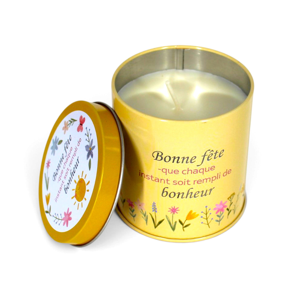 Bougie InnerVoice « Bonne fête – que chaque instant soit rempli de bonheur » en boîte métallique jaune, ouverte avec la cire et la mèche visibles, couvercle posé à côté.