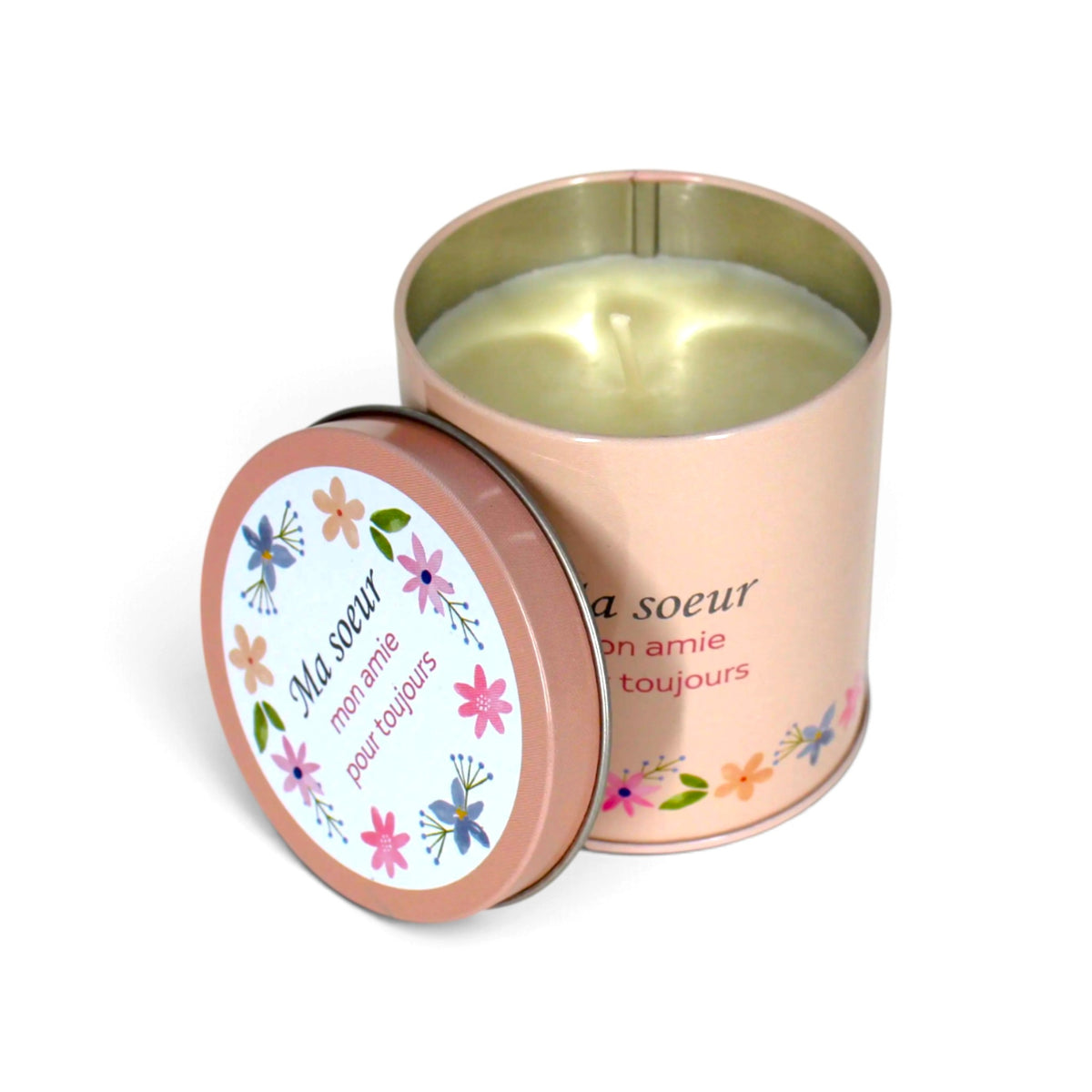 Bougie InnerVoice « Ma sœur, mon amie pour toujours » en boîte métallique rose, ouverte avec la cire et la mèche visibles, couvercle posé à côté.