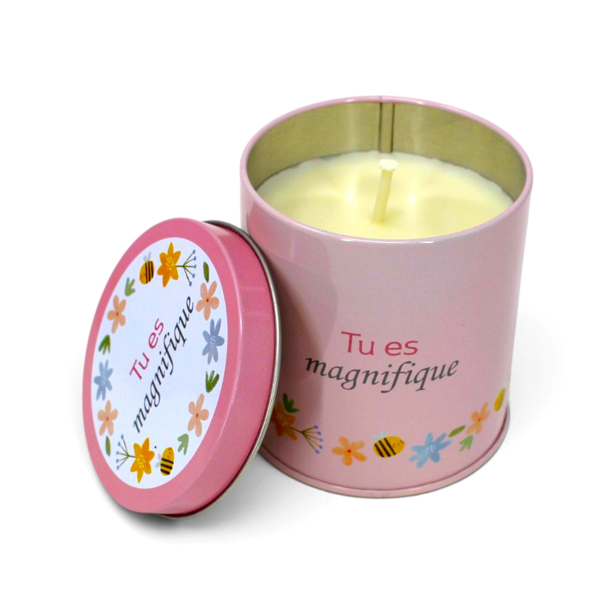 Bougie InnerVoice « Tu es magnifique » en boîte métallique rose, ouverte avec la cire et la mèche visibles, couvercle posé à côté.