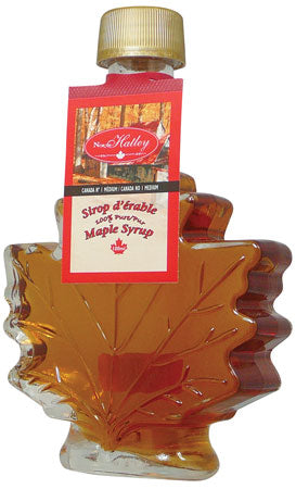 Bouteille en verre en forme de feuille contenant du sirop d’érable North Hatley – 100 ml