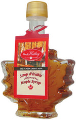 Bouteille en verre en forme de feuille contenant du sirop d’érable North Hatley – 50 ml