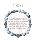 Bracelet Earth Angel « Force » à perles blanches et grises, avec sa présentation en français.
