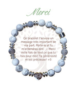 Bracelet Earth Angel « Merci » à perles blanches et grises, avec sa présentation en français.