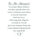 Message en français sur la carte de l’épinglette « Tu me manques ».