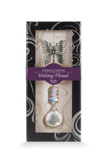 Fil à vœux Papillon Eternity Crystal présenté dans sa boîte illustrée avec son cristal facetté.