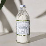 Bouteille de lait de bain Dot & Lil sur fond clair