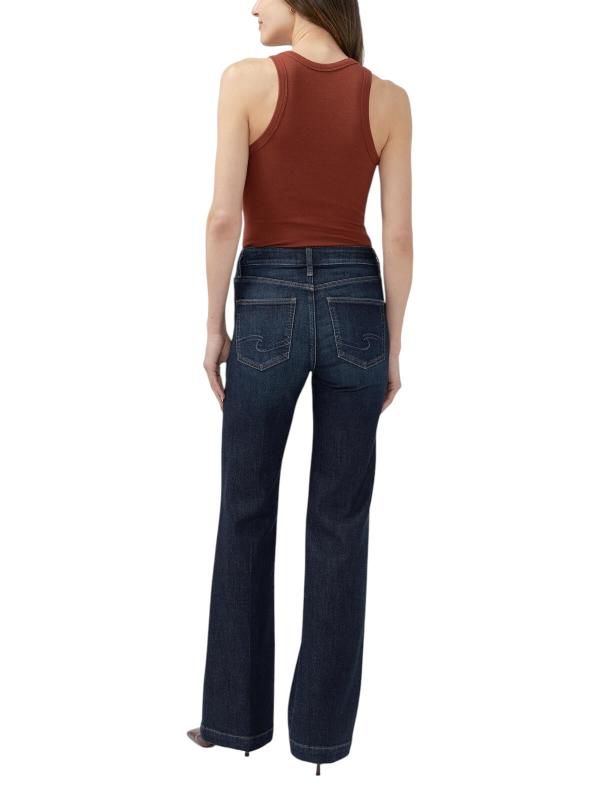Maison Taïga Avery curvy fit high-rise dark indigo trouser jeans with a flared leg, back view on a model.