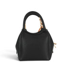 Sac à main Maison Taïga noir en cuir vegan avec anses structurées et bandoulière ajustable pour un style urbain
