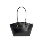 Sac à main noir Maison Taïga avec poignées fines et détails dorés sur fond blanc