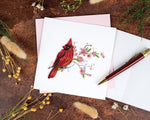 Carte de vœux cardinal rouge et fleurs de cerisier en papier roulé
