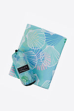 Serviette de plage Solem Coquilluxe XL, serviette pliée avec pochette
