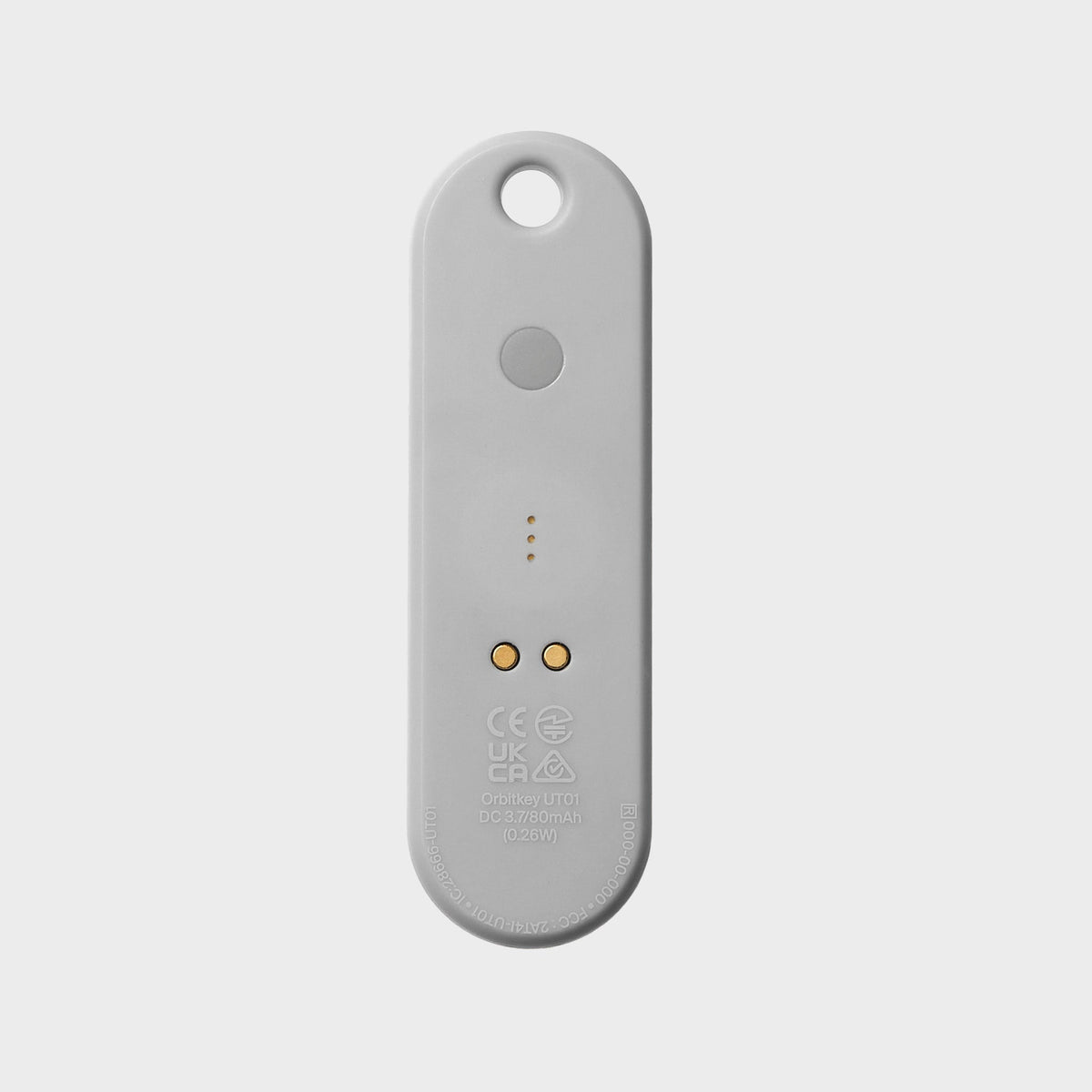 Traceur universel Orbitkey — gris granite — face arrière et contacts de recharge