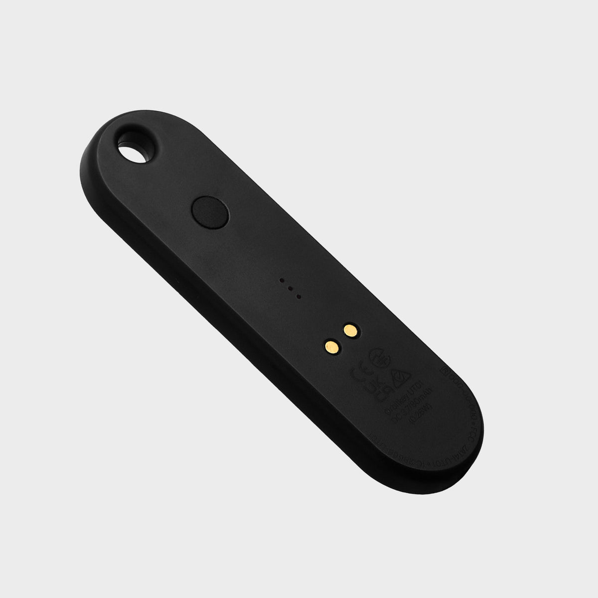 Traceur universel Orbitkey — noir — face arrière et contacts de recharge