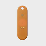 Traceur universel Orbitkey — orange mandarine — face arrière et contacts de recharge