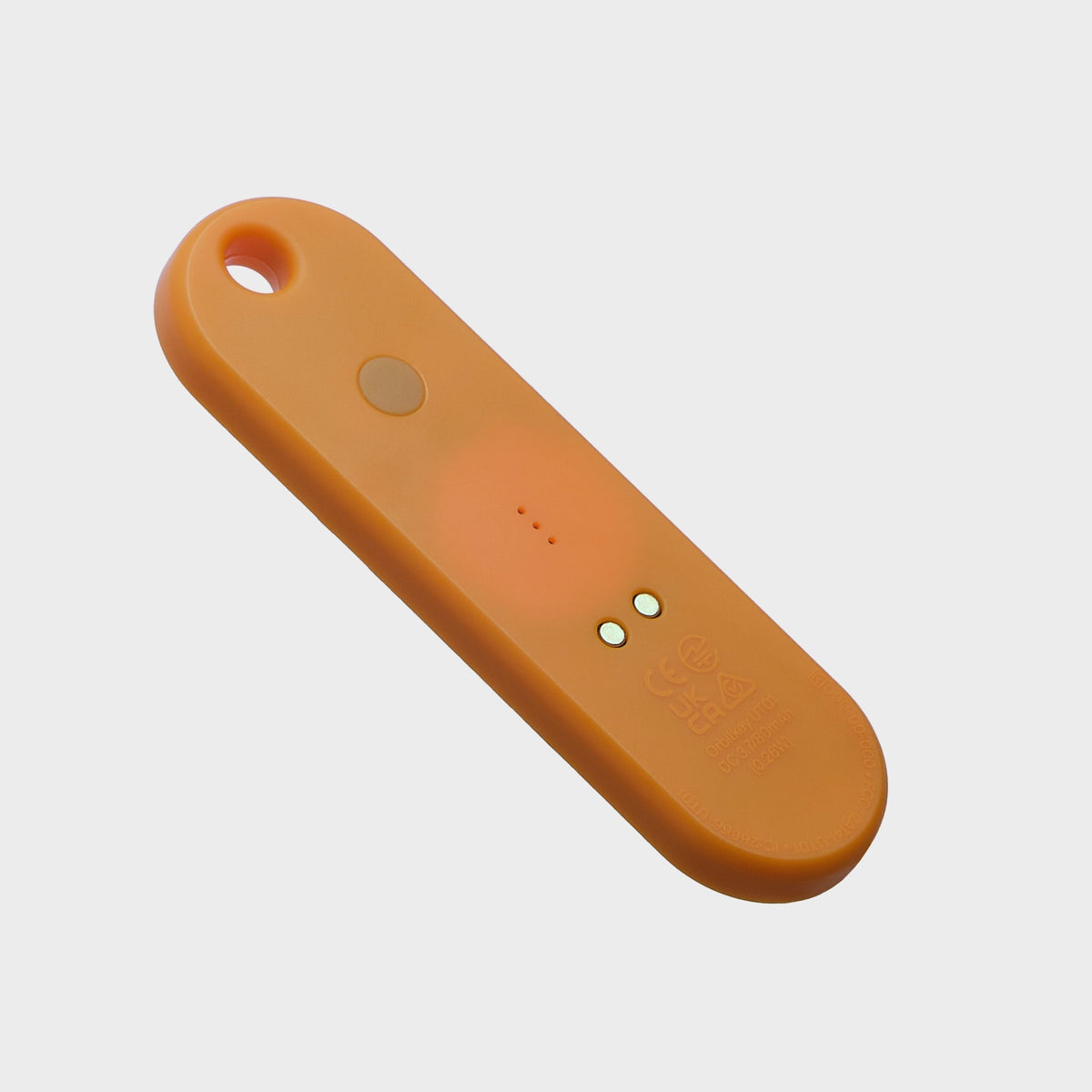 Traceur universel Orbitkey — orange mandarine — face arrière et contacts de recharge