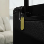 Traceur universel Orbitkey — traceur pistache fixé à une valise
