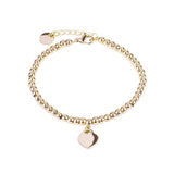 Bracelet doré à mailles et petit médaillon