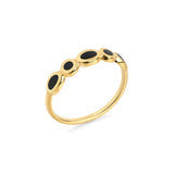 Bague dorée ornée de trois ovales noirs