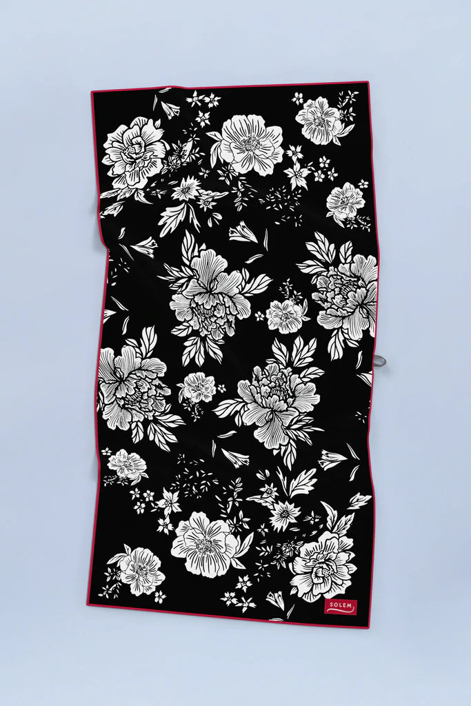 Serviette de plage Solem Simone XL, recto floral noir et blanc